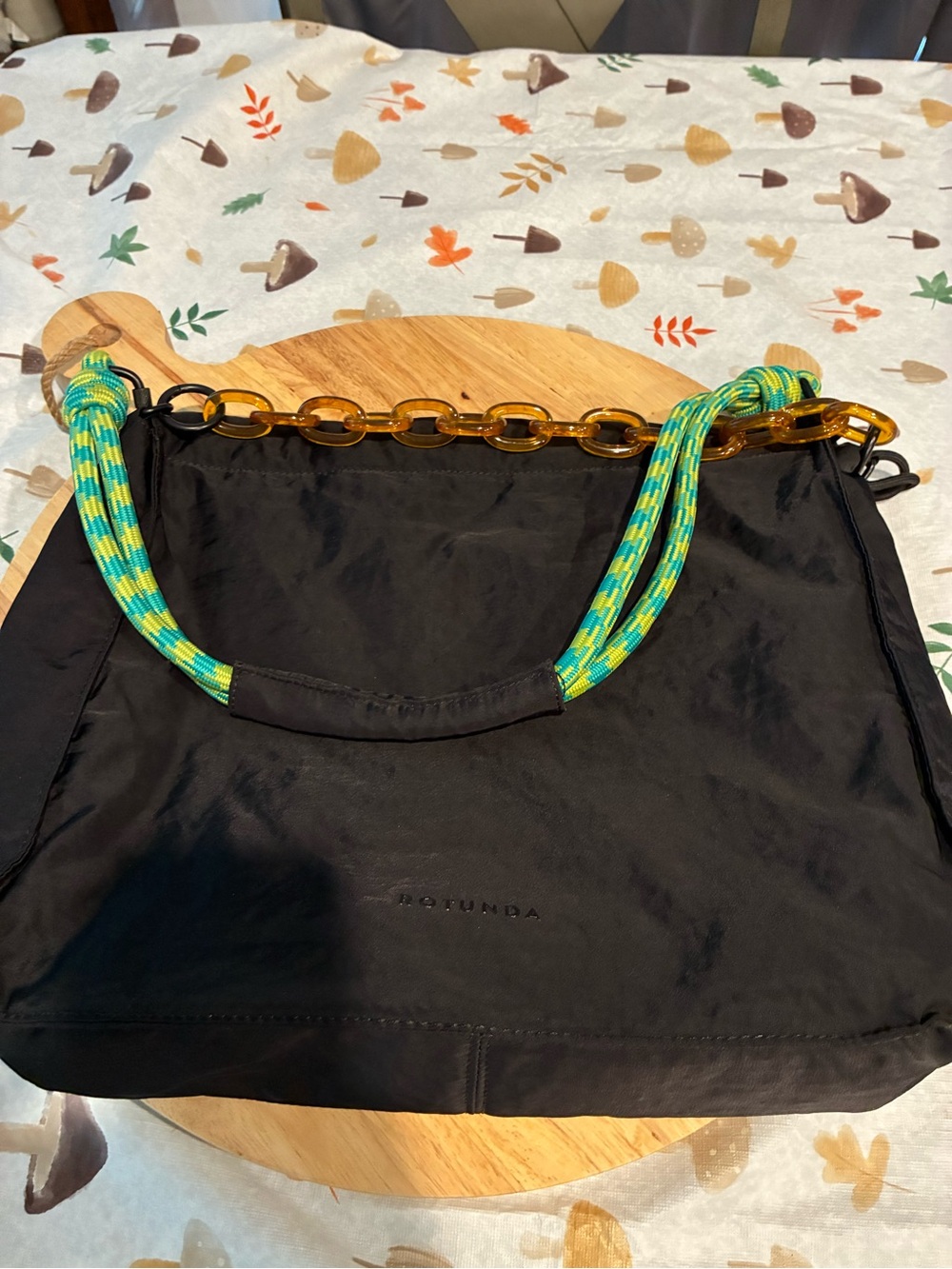 Rotunda Black Shoulder Bag with Green Rope and tortoise chain